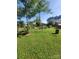 Expansive backyard with lush green grass and mature trees offering shade and privacy at 111 Redwood Ln, Gastonia, NC 28052
