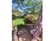 Picturesque backyard with a vibrant rose bush and a wooden staircase leading to an upper level at 111 Redwood Ln, Gastonia, NC 28052
