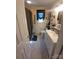 A light-filled bathroom features a shower with a checkered curtain and a white vanity at 111 Redwood Ln, Gastonia, NC 28052