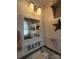 A vintage bathroom features wood paneling, decorative stars, and a pedestal sink at 111 Redwood Ln, Gastonia, NC 28052