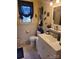 A well-lit bathroom features blue decor and a white sink and toilet at 111 Redwood Ln, Gastonia, NC 28052