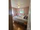 The bedroom features a queen-sized bed with floral bedding and a side table by a window at 111 Redwood Ln, Gastonia, NC 28052