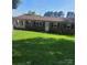 Charming brick home with a large, well-maintained front yard and inviting curb appeal at 111 Redwood Ln, Gastonia, NC 28052