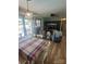 A comfy living room features a dining table and chairs, entertainment center, and two comfy recliner chairs at 111 Redwood Ln, Gastonia, NC 28052