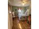 The primary bedroom features light green walls and hardwood floors, and natural light at 111 Redwood Ln, Gastonia, NC 28052