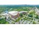Aerial view of a large mill complex with multiple buildings, surrounded by parking and trees at 1113 W 4Th Ave, Gastonia, NC 28052