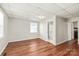 Bedroom with bright natural light, with a view of the bathroom, features wood laminate flooring at 1113 W 4Th Ave, Gastonia, NC 28052