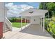 Carport and rear of the property with ample parking and an eagle statue at 1113 W 4Th Ave, Gastonia, NC 28052