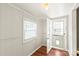 Mud room with door to the outside and a window providing natural light and neutral tones at 1113 W 4Th Ave, Gastonia, NC 28052