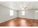 Inviting living room with wood flooring, ceiling fan, and natural light, perfect for creating a cozy atmosphere at 1113 W 4Th Ave, Gastonia, NC 28052