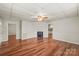Bright living room with shiny wood floors and neutral walls offers a clean, versatile space for your design vision at 1113 W 4Th Ave, Gastonia, NC 28052