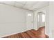 Comfortable living room with wood-look flooring and plenty of natural light, ready for your personal touches at 1113 W 4Th Ave, Gastonia, NC 28052