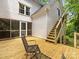 Spacious deck with stairs offers a private outdoor retreat to enjoy the serene surroundings at 1119 Holleybank Dr, Matthews, NC 28105