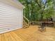 Relaxing deck with stairs to the backyard, providing seamless indoor-outdoor living at 1119 Holleybank Dr, Matthews, NC 28105