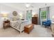 Bright bedroom with white walls, a decorative headboard, and large windows dressed with blue curtains at 1119 Holleybank Dr, Matthews, NC 28105