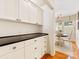 Pantry with custom cabinets, granite countertops, and a view into an eat-in kitchen at 1119 Holleybank Dr, Matthews, NC 28105