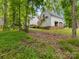 View of the house with wooden stairs and a covered area for outside seating at 1119 Holleybank Dr, Matthews, NC 28105