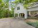 Home exterior with a covered parking area, screened in porch and well maintained yard at 1119 Holleybank Dr, Matthews, NC 28105