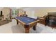Large game room featuring a pool table, treadmill, and cozy seating, perfect for leisure and fitness at 1119 Holleybank Dr, Matthews, NC 28105