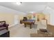 Spacious game room with a pool table, comfortable seating, and ample space for entertainment at 1119 Holleybank Dr, Matthews, NC 28105