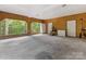 Spacious garage with exercise equipment, storage, and potential workspace at 1119 Holleybank Dr, Matthews, NC 28105