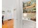 Hallway features hardwood floors, white trim, and decorative shelves with stylish accents at 1119 Holleybank Dr, Matthews, NC 28105