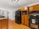 Spacious kitchen with wood cabinets, stainless appliances, and hardwood floors at 1119 Holleybank Dr, Matthews, NC 28105