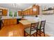 Eat-in kitchen with granite counters, wood cabinets, and stainless steel appliances at 1119 Holleybank Dr, Matthews, NC 28105