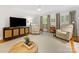 Cozy living room with stylish furnishings, a large TV, and neutral color scheme at 1119 Holleybank Dr, Matthews, NC 28105