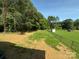 Spacious backyard with a fence and small shed backed by a line of mature trees at 112 Gilliatt St # 1, Shelby, NC 28150