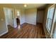 Bright bedroom with hardwood floors, ceiling fan, and a walk-in closet with an ensuite bathroom at 112 Gilliatt St # 1, Shelby, NC 28150