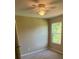 This bedroom features a ceiling fan and a window bringing in natural light at 112 Gilliatt St # 1, Shelby, NC 28150
