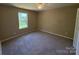 Bedroom featuring neutral walls, plush carpet, and natural light from the window at 112 Gilliatt St # 1, Shelby, NC 28150
