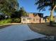 Charming two-story home with a newly paved driveway and fresh landscaping at 112 Gilliatt St # 1, Shelby, NC 28150