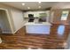 Bright kitchen features white cabinets, stainless steel appliances, and a large island with wood floors at 112 Gilliatt St # 1, Shelby, NC 28150
