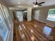Spacious living room featuring beautiful hardwood floors, open layout, and stairs to the second floor at 112 Gilliatt St # 1, Shelby, NC 28150