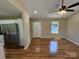A contemporary living room features hardwood floors, an open layout, and stairs to the second floor at 112 Gilliatt St # 1, Shelby, NC 28150
