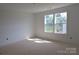 A bedroom with white walls and a double window providing natural light at 118 Still Creek Dr, Mooresville, NC 28115