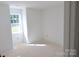 Bedroom with a large window providing natural light and fresh white paint awaiting final touches at 118 Still Creek Dr, Mooresville, NC 28115