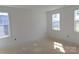A bedroom with white walls and three windows providing natural light at 118 Still Creek Dr, Mooresville, NC 28115