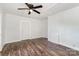 Open bedroom with ceiling fan, trim and vinyl floors at 1224 Hollywood Ter, Albemarle, NC 28001