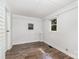 Bedroom with window, brick detail and vinyl floors at 1224 Hollywood Ter, Albemarle, NC 28001
