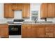 Traditional kitchen equipped with wood cabinets, updated appliances, and laminate countertops at 1224 Hollywood Ter, Albemarle, NC 28001