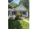 Charming single-story home featuring a classic front porch and well-maintained lawn at 124 Powder Sw St, Concord, NC 28025