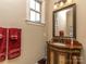 Ornate bathroom featuring a beautifully crafted vanity, detailed mirror, and warm lighting creates a luxurious feel at 1377 Shinnecock Ln, Fort Mill, SC 29707