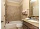 Comfortable bathroom with tile shower, vanity with granite counters and framed mirror provides a relaxing experience at 1377 Shinnecock Ln, Fort Mill, SC 29707