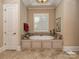 Relaxing bathroom with a large soaking tub at 1377 Shinnecock Ln, Fort Mill, SC 29707