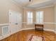 Bright bedroom with hardwood floors, white trim, and large windows provides a comfortable and inviting atmosphere at 1377 Shinnecock Ln, Fort Mill, SC 29707