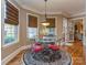 Cozy breakfast nook with large windows and elegant chandelier at 1377 Shinnecock Ln, Fort Mill, SC 29707