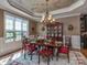Formal dining room with elegant chandelier and natural light at 1377 Shinnecock Ln, Fort Mill, SC 29707